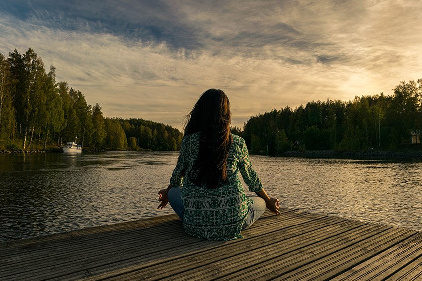 meditating at sunset