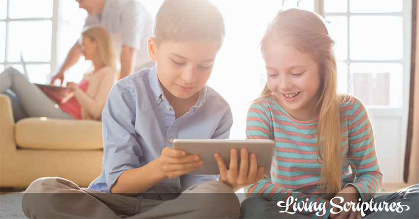 Boy and girl watching Living Scriptures