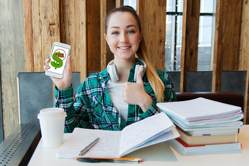 teen entrepreneur celebrating a sale