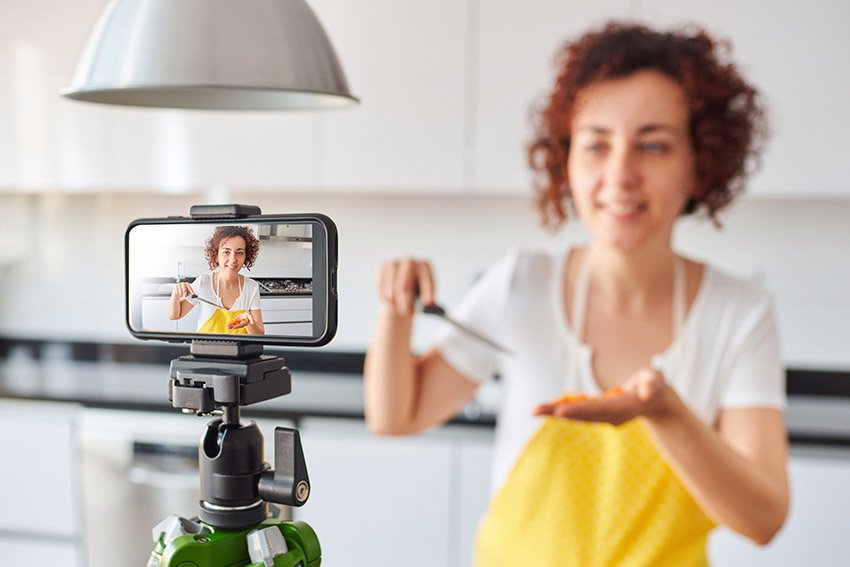 woman making video with cellphone to practice public speaking